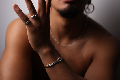 Handcrafted Minimal Style Silver Bangle-The Knot — model wearing knot bangle and rings