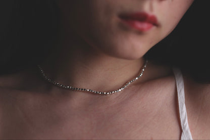 Minimalist Handcrafted Silver Beaded Necklace-Thick — beaded necklace worn with a pale top