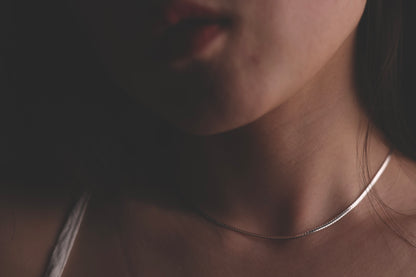 Handcrafted Minimalist Basic Silver Chain Necklace — close-up of chain necklace worn around the neck
