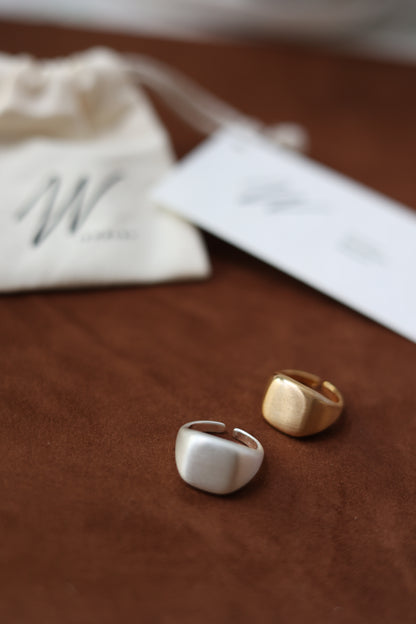 The Minimal Signet Ring — two signet rings and branded cards