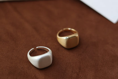 The Minimal Signet Ring — close-up of two signet ring finishes