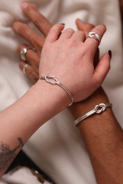 Handcrafted Minimal Style Silver Bangle-The Knot — matching bangles worn by two people