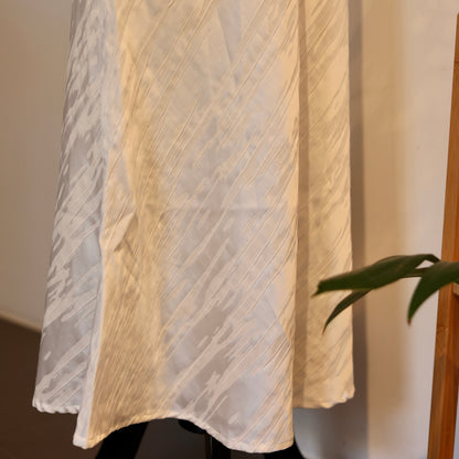 White Triacetate Skirt — close-up of white skirt fabric