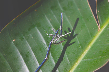 Bamboo Hair Pin — bamboo-shaped hair pin on a sunlit leaf