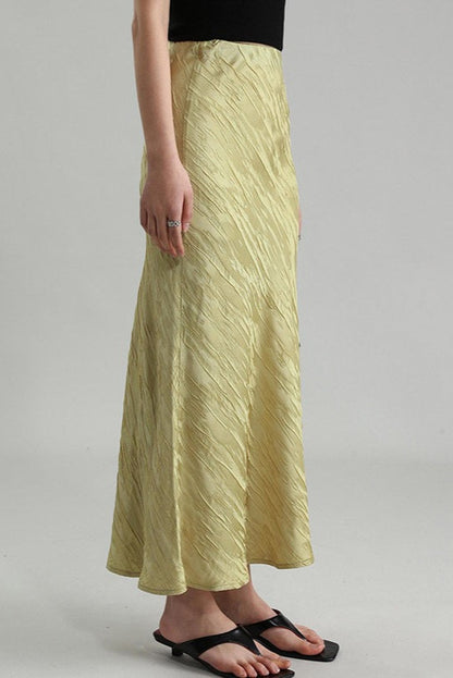 Gold Triacetate Skirt — gold-coloured maxi skirt worn with sandals