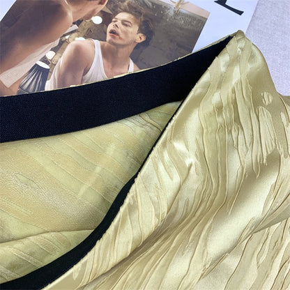 Gold Triacetate Skirt — close-up of gold-coloured skirt fabric and waistband