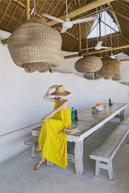 Bright Beach Holiday Dress — yellow holiday dress worn on a terrace