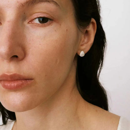 The Shell-Ear Stud — close-up of model wearing a shell stud