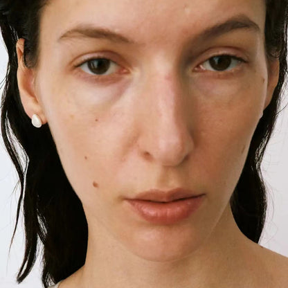 The Shell-Ear Stud — front view of model wearing shell studs