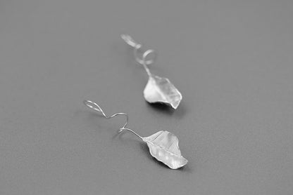 The Leaves -Earrings — front view of silver-tone leaf earrings